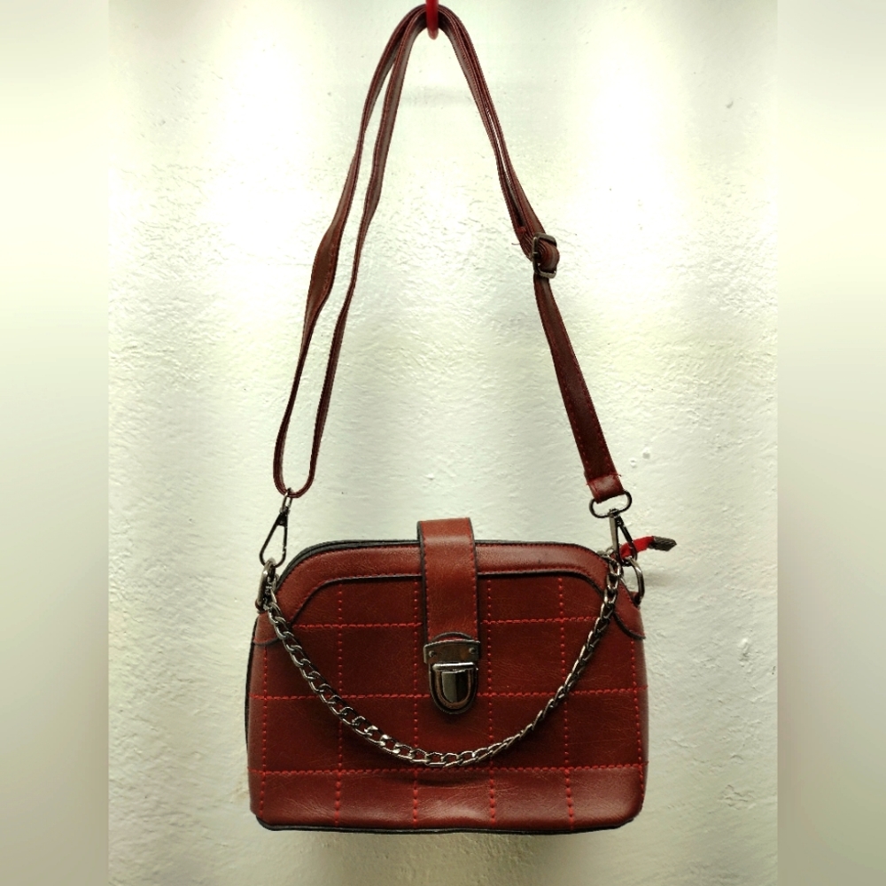 Women's burgundy faux leather handbag